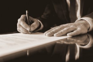 signing paperwork for scottish legal system header